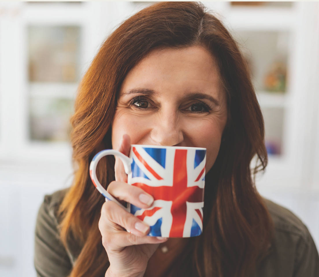 Niki Hardy with brit mug Smiling person on a poster for the 2026 FPC Women's Retreat with encouraging text about faith and personal growth.